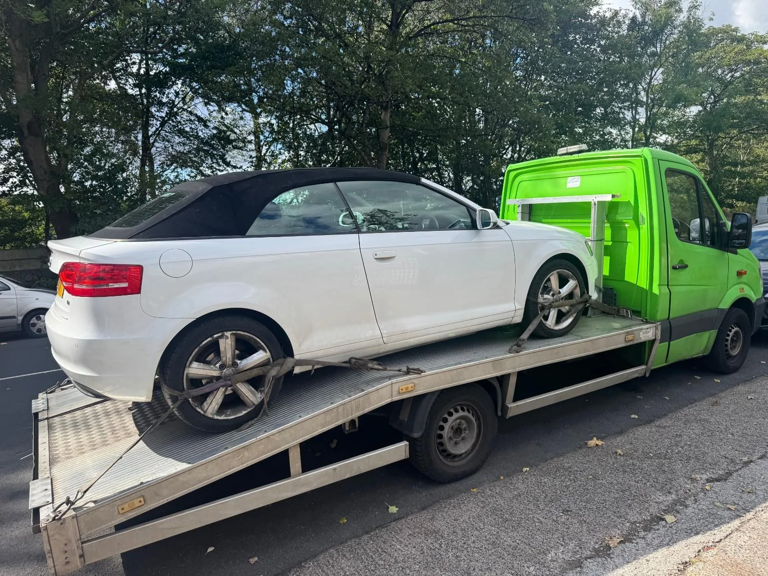White car on recovery truck